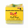 A bar of handmade artisan soap labeled 'Peach Mango' by Lakay Remedies, featuring a bright yellow label with peach illustrations and a visible marbled soap top with green and orange tones, on a white background.