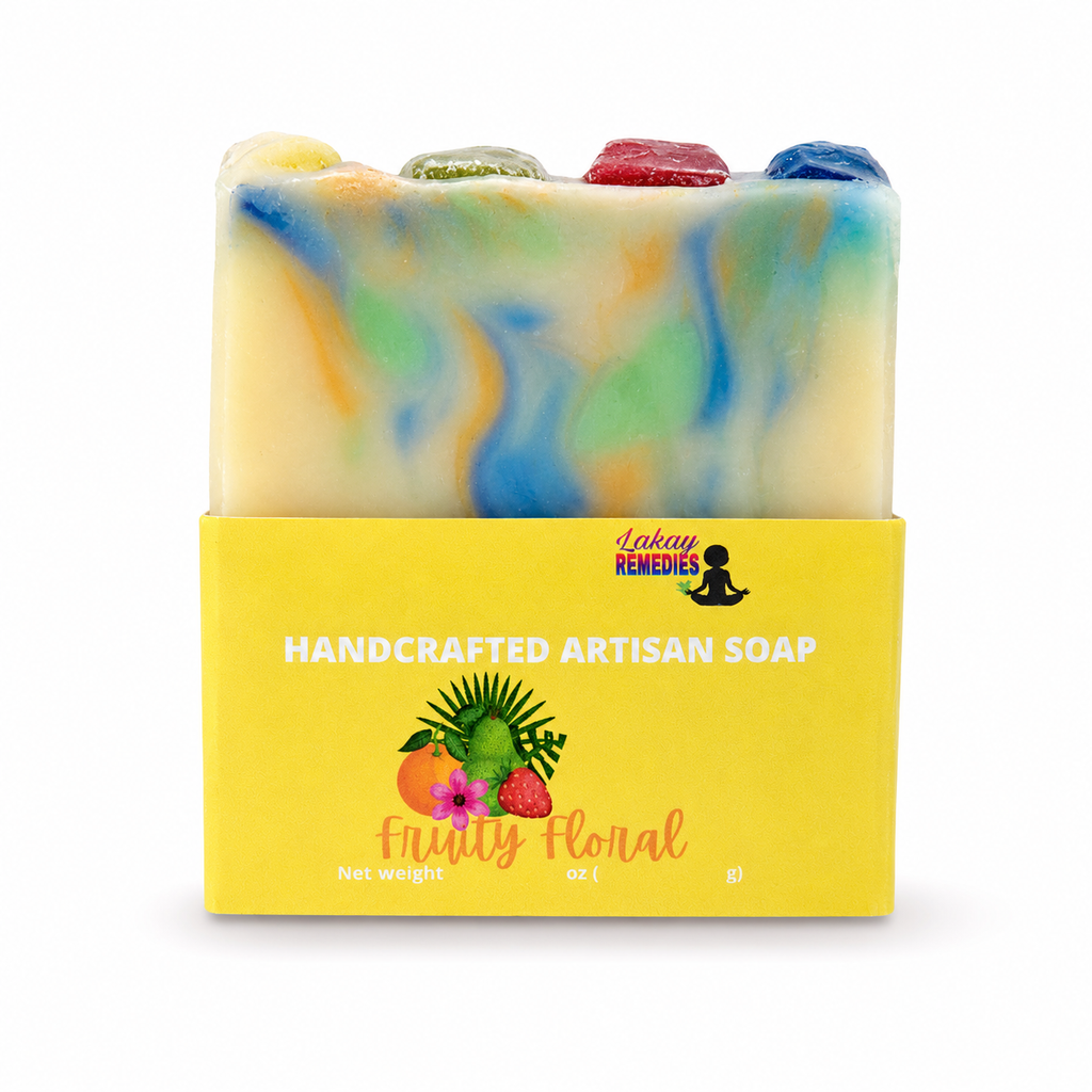 A handmade artisan soap bar with a yellow wrapper. The soap has a marbled pattern of cream, blue, green, and orange, with colorful stone-like tops.