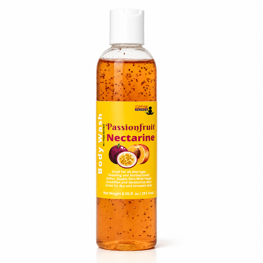 A bottle of Passionfruit Nectarine body wash by Lakay Remedies, featuring a yellow label and white cap, filled with orange liquid containing small dark fruit seeds, on a white background.