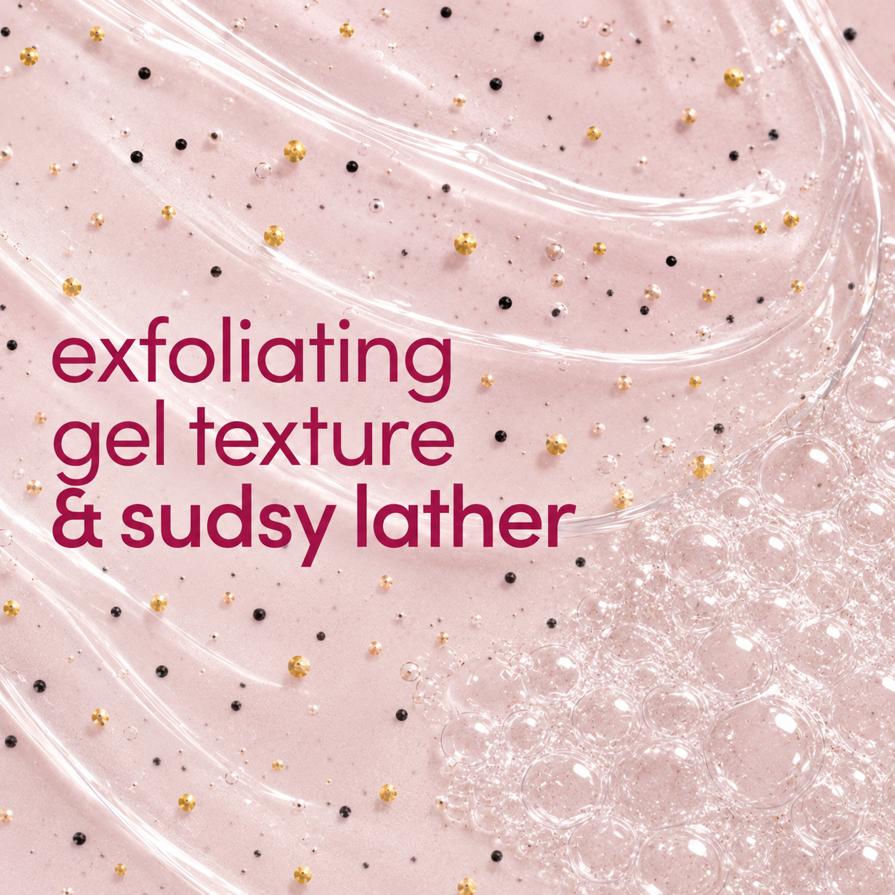 A close-up texture shot of a pale pink exfoliating gel with visible black and gold specks, overlaid with the text 'exfoliating gel texture & sudsy lather' in dark pink.