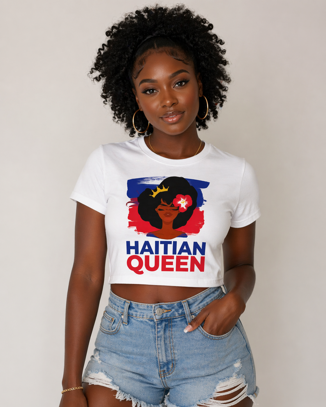 Woman wearing a white t-shirt with 'Haitian Queen' design on a plain background