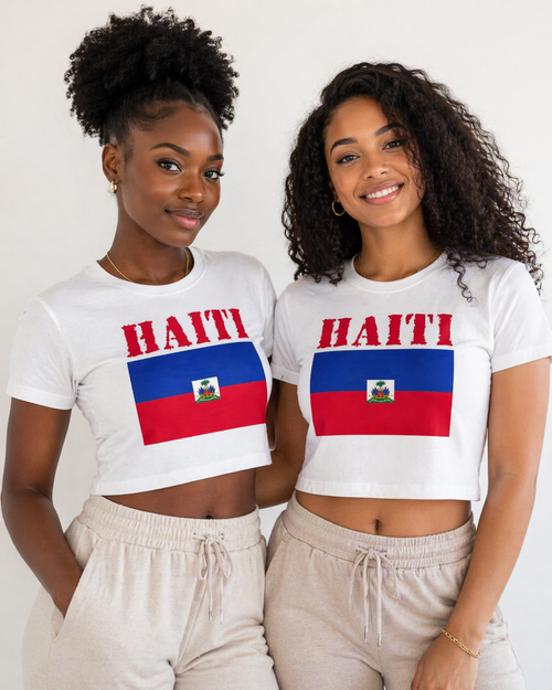 Two women wearing white t-shirts with Haiti text and flag design on a plain background