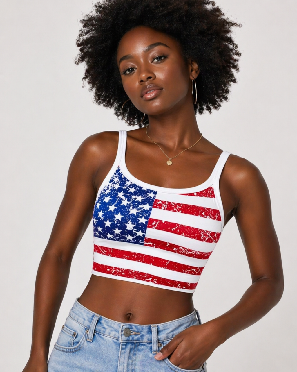 Woman wearing a tank top with an American flag design on a plain background