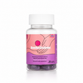 A clear plastic bottle of Boobalicious dietary supplements with a white cap, featuring a pink and purple label with an illustration of hands on a breast. Purple capsules are visible through the clear bottle at the bottom.